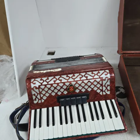 ANTIQUE RUSSIAN GARMON ACCORDION WITH RED MARBLED EXTERIOR AND STRAP – WITH HARD CASE MANUFACTURED IN LENINGRADKOYE