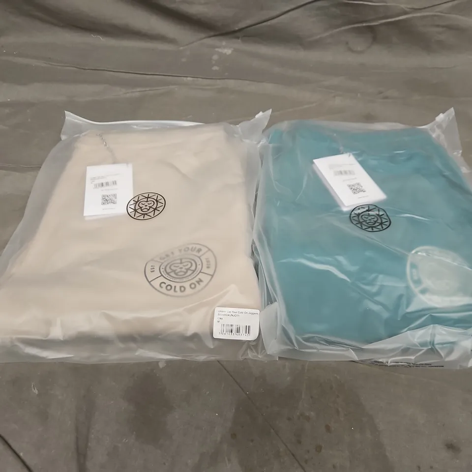 APPROXIMATELY 18 ASSORTED BAGGED UNISEX GET YOUT COLD ON JOGGERS IN VARIOUS SIZES TO INCLUDE COLOURS SUCH AS GREEN & CLAY