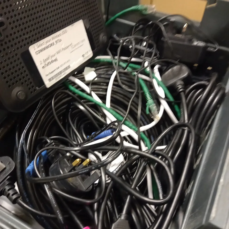 ASSORTMENT OF CABLES AND WIRES PLUS A COMMWORX ROUTER 