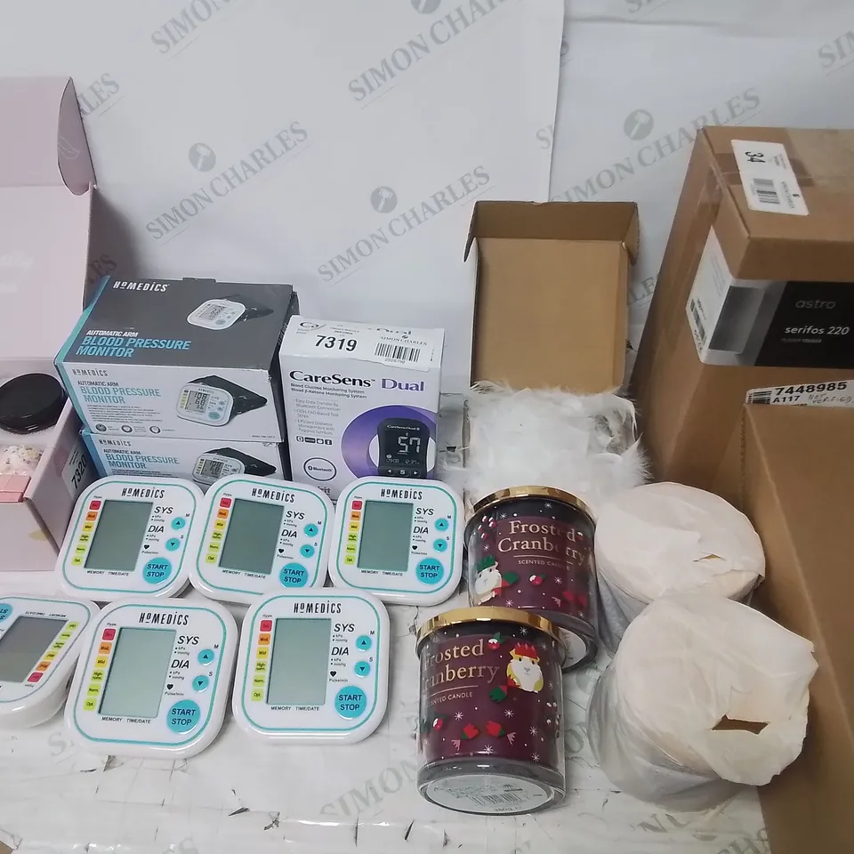 LOT OF APPROXIMATELY 26 ASSORTED ITEMS TO INCLUDE BLOOD PRESSURE MONITOR, SCENTED CANDLES AND WIRELESS KEYBOARD AND MOUSE COMBOS 
