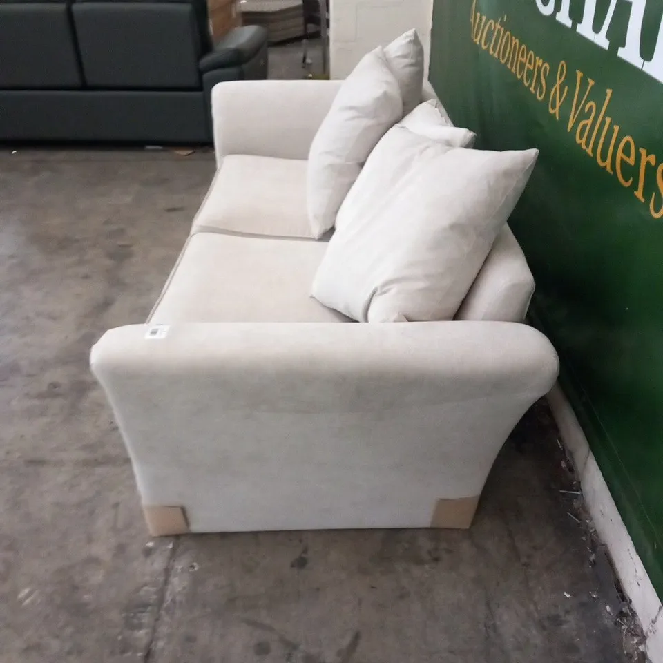 DESIGNER DURY BEIGE FABRIC THREE SEATER SOFA WITH SCATTER CUSHIONS