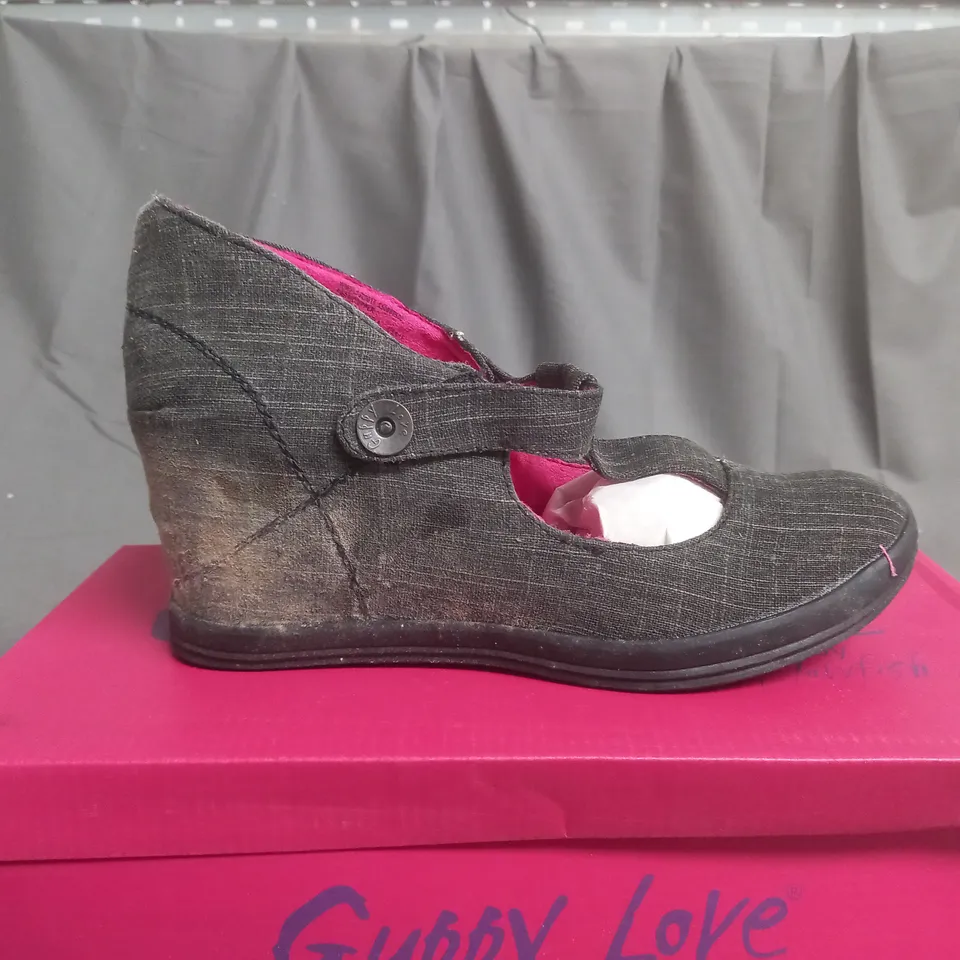 BOX OF APPROXIMATELY 12 BLACK  GUPPY LOVE BY BLOWFISH SHOES IN VARIOUS SIZES 