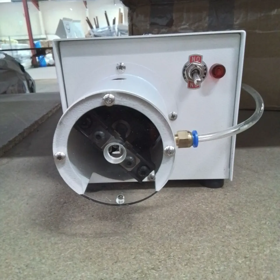 A BOXED WIRE STRIPPING AND TWISTING MACHINE 