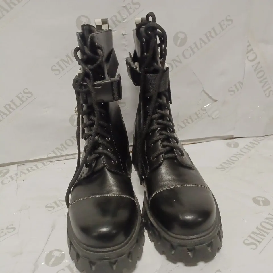 PAIR OF KOI DESIGNER VEGAN PLATFORM ANKLE BOOTS IN BLACK WITH CHECKERBOARD PATTERN - SIZE 6