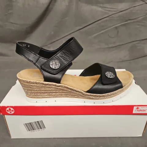 BOXED PAIR OF WOMENS RIEKER BLACK STRAP WEDGE SANDALS - UK SIZE 41