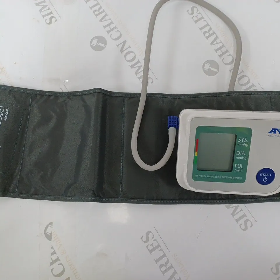 BOXED AND BLOOD PRESSURE MONITOR UA-767S-W