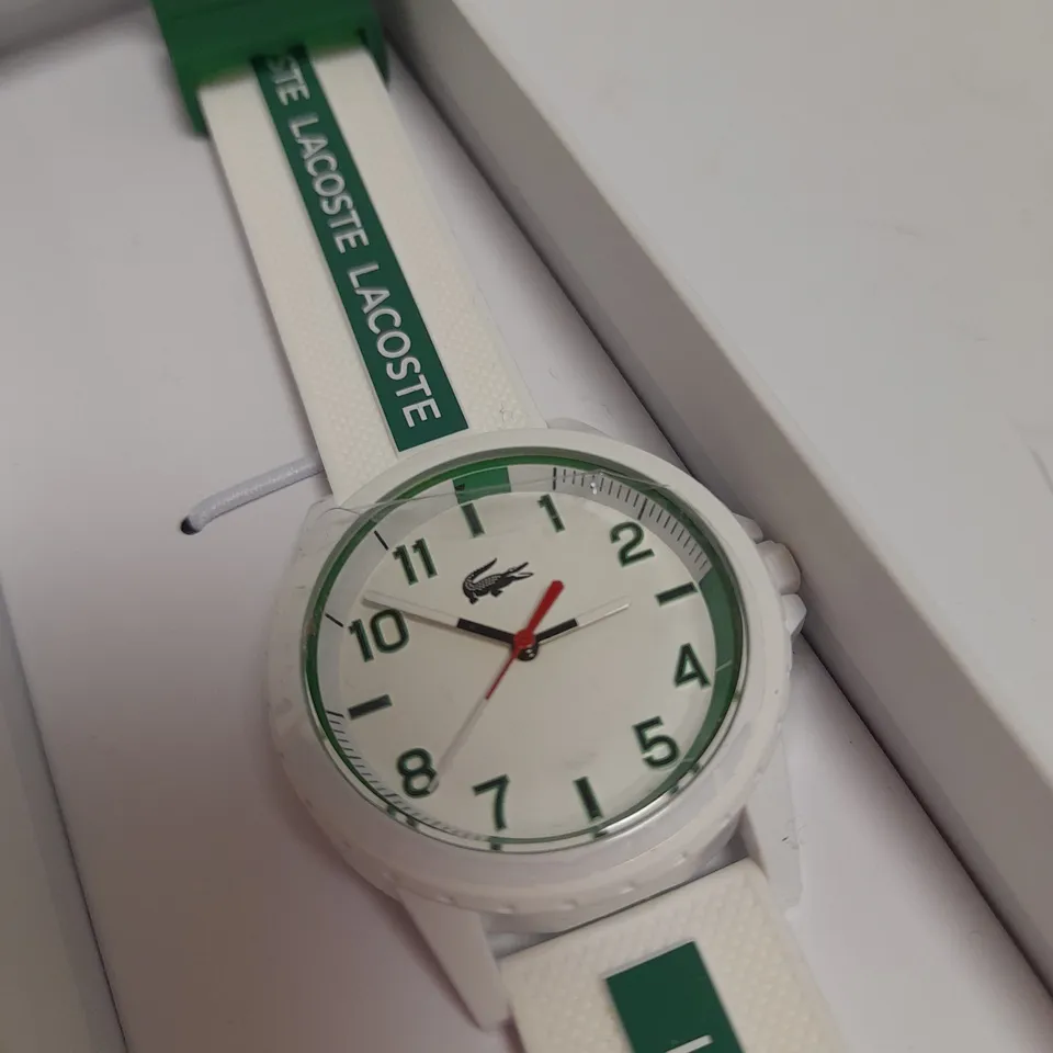 LACOSTE WHITE DIAL WATCH WITH WHITE AND GREEN STRAP DETAIL