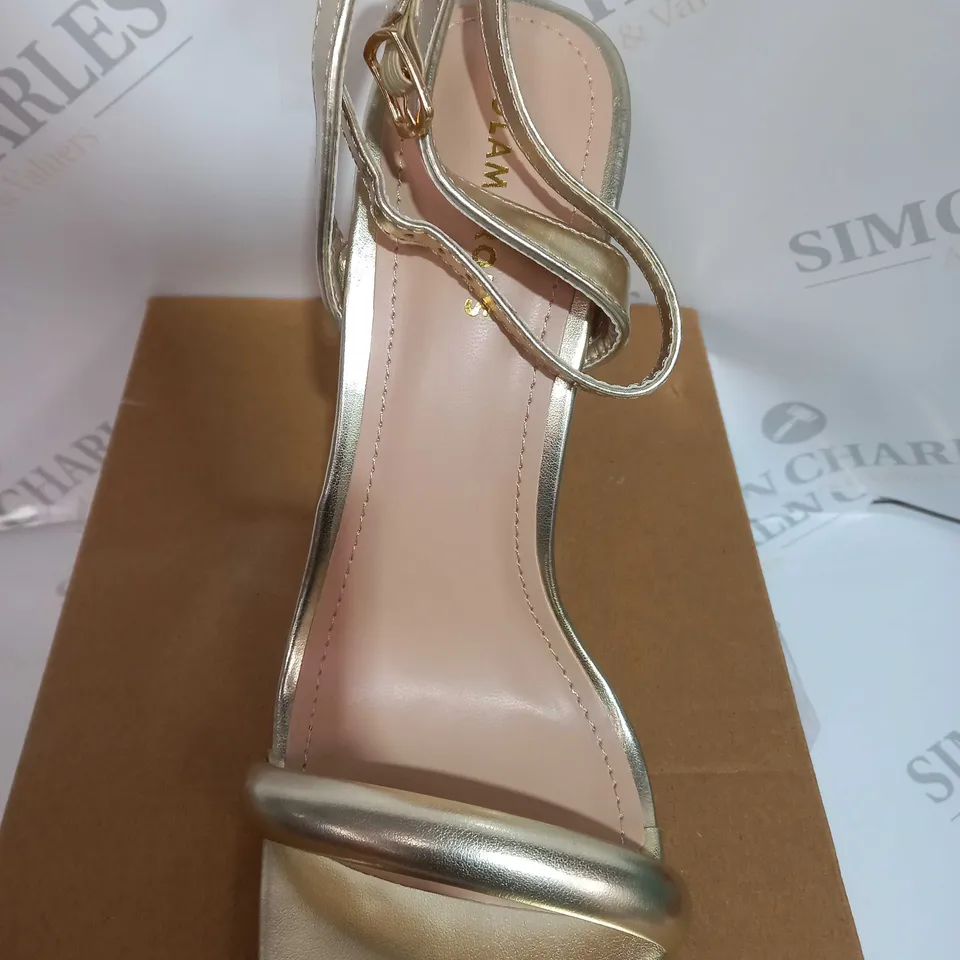 BOXED PAIR OF LADIS GLAMOROUS HEELS IN GOLD SIZE UK7 