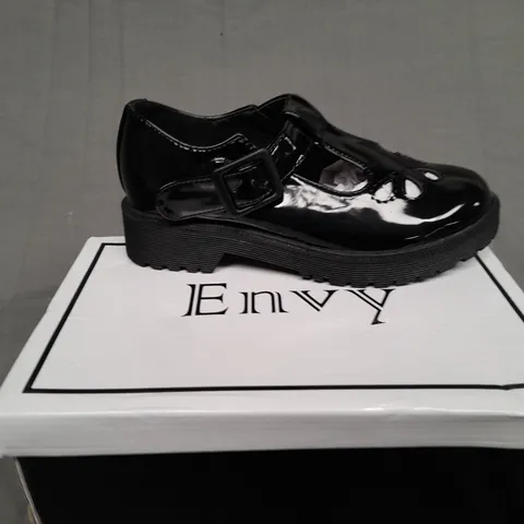 BOXED PAIR OF ENVY SIZE 31 BLACK PATENT BUCKLE TRAINER