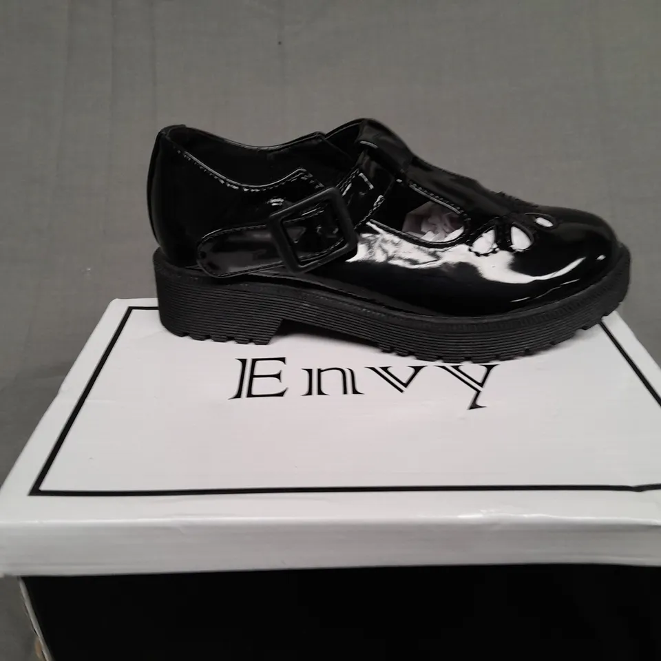 BOXED PAIR OF ENVY SIZE 31 BLACK PATENT BUCKLE TRAINER 