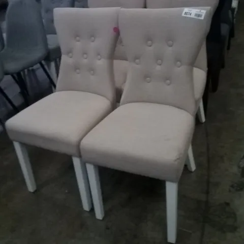 APPROXIMATELY 4 BEIGE FABRIC BUTTON BACK DINING CHAIRS WITH WHITE LEGS