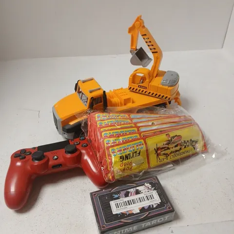 APPROXIMATELY 10 ASSORTED TOYS AND GAMES TO INCLUDE PS4 CONTROLLER, TOY TRUCK, TAROT CARDS ETC