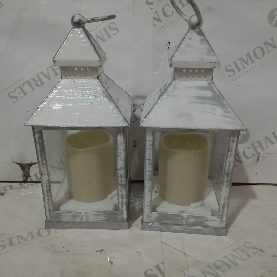 ASTIN OF LONDON PAIR OF CANDLE LANTERNS IN RUSTIC WHITE