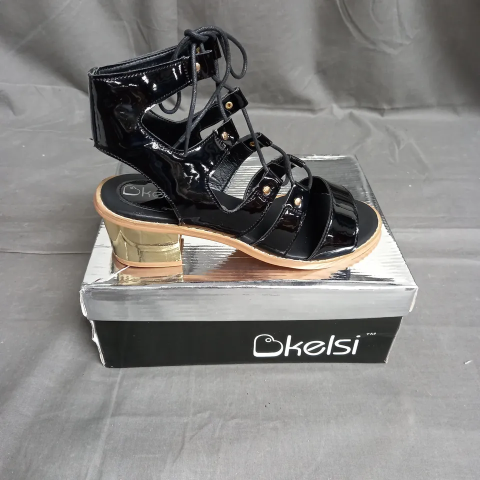 BOX OF APPROXIMATELY 12 PAIRS OF KELSI STRAP HEELED SANDALS IN BLACK  - VARIOUS SIZES