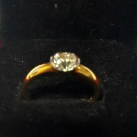 18CT GOLD SOLITAIRE RING SEMI-RUB-OVER-SET WITH A DIAMOND WEIGHING +0.75CT