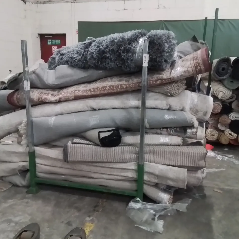 STILLAGE TO CONTAIN APPROXIMATELY 30 QUALITY DESIGNER RUGS