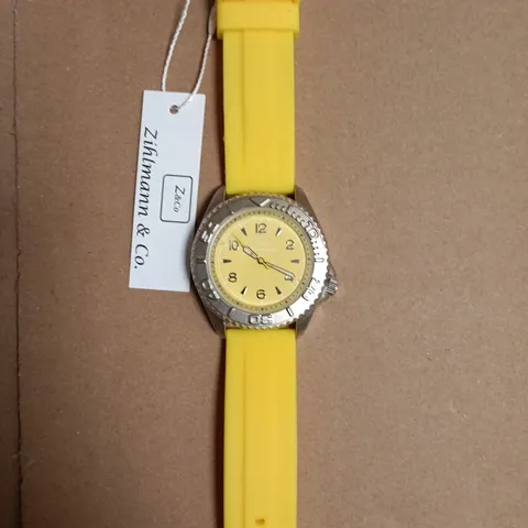 BOXED ZICHMANN & CO STAINLESS STEEL CASEBACK WATCH WITH YELLOW SILICONE STRAP