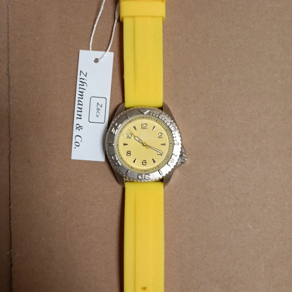 BOXED ZICHMANN & CO STAINLESS STEEL CASEBACK WATCH WITH YELLOW SILICONE STRAP