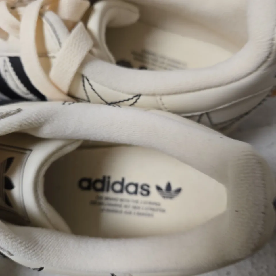ADIDAS SUPERSTAR TRAINERS – CREAM/OFF-WHITE WITH BLACK STRIPES UK 7.5