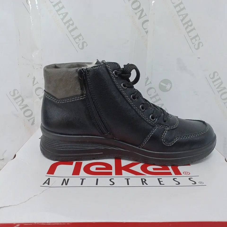 BOXED PAIR OF RIEKER WATER RESISTANT BOOTS IN BLACK SIZE 5