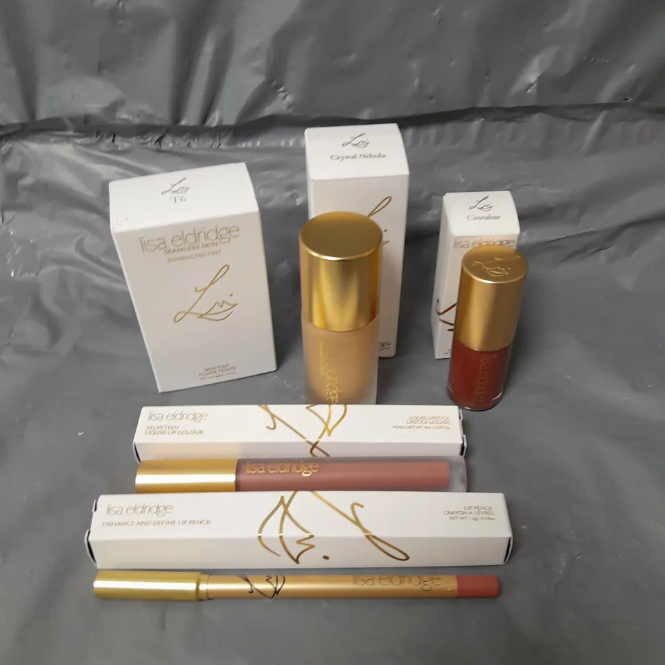 LOT OF 5 LISA ELDRIDGE MAKE UP PRODUCTS TO INCLUDE FOUNDATION, LIP GLOSS AND A LIP PENCIL