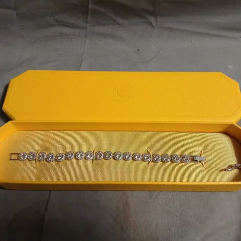 SWAROVSKI BRACELET WITH PAVÉ-SET CLEAR STONES IN YELLOW DISPLAY BOX
