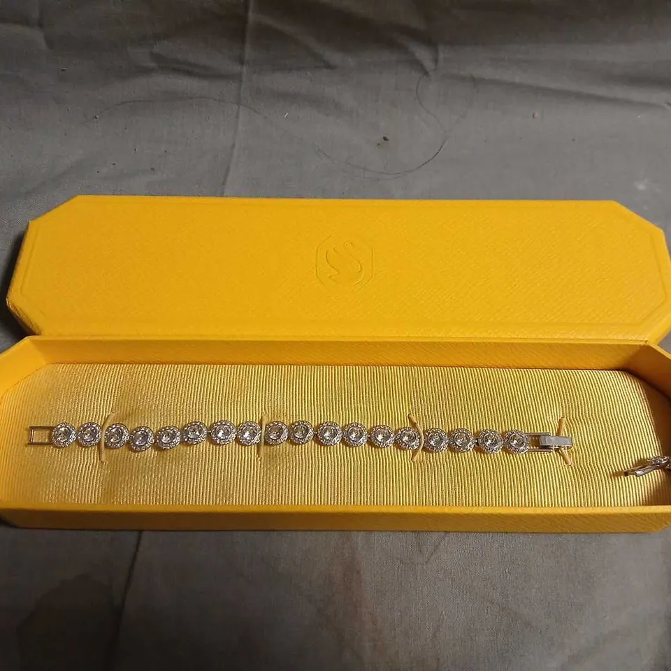 SWAROVSKI BRACELET WITH PAVÉ-SET CLEAR STONES IN YELLOW DISPLAY BOX
