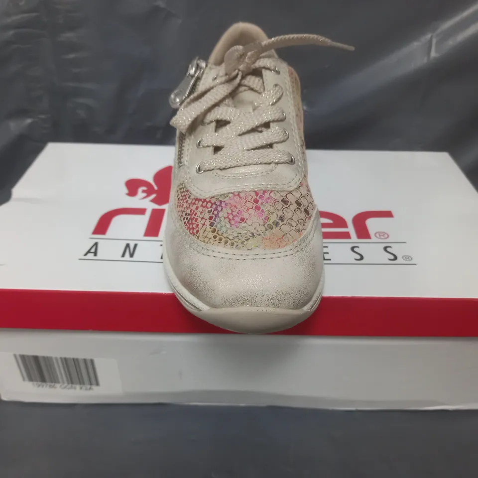 BOXED PAIR OF RIEKER TRAINERS IN GOLD SIZE 3.5