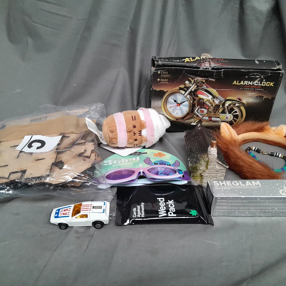 APPROXIMATELY 10 ASSORTED TOYS AND GAMES TO INCLUDE STITCH, ALARM CLOCK AND TEDDIES