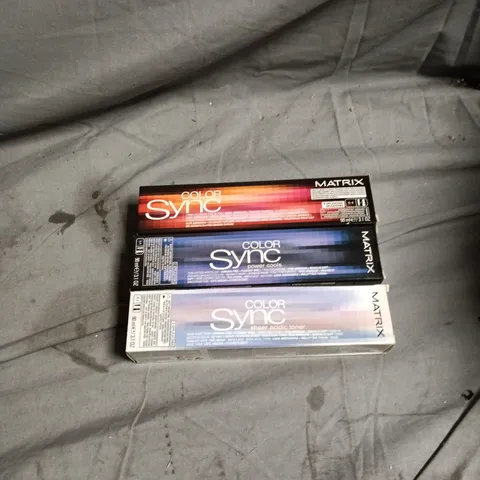 BOX OF APPROXIMATELY 60 ASSORTED MATRIX HAIR CARE PRODUCTS INCLUDING COLOR SYNC MEDIUM BLONDE MOCHA VIOLET/BRUNETTE ASH/MEDIUM BLONDE VIOLET ASH/BRUNETTTE NEUTRAL/DARK BLONDE MOCHA ASH