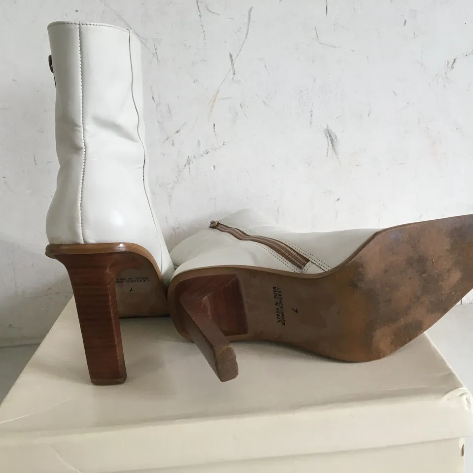 BOXED PAIR OF SIZE 7 HIGH HEEL BOOTS