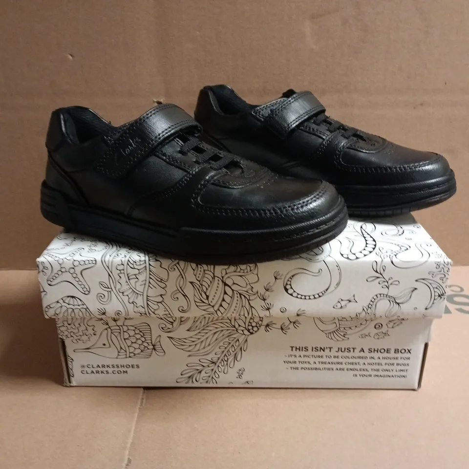 BOXED PAIR OF CLARKS KIDS VELCRO STRAP SHOES IN BLACK SIZE UK 12