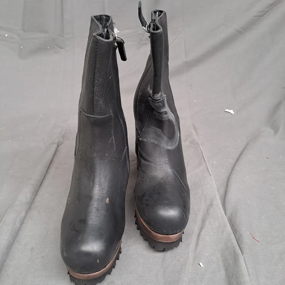 BOX OF APPROXIMATLY 6 WOODEN BOTTOM LEATHER BOOT VARIOUS SIZES 