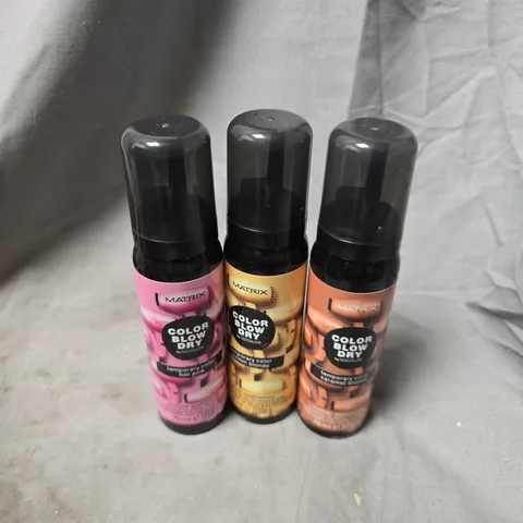 APPROXIMATELY 20 ASSORTED MATRIX BLOW DRY SPRAYS TO INCLUDE CARAMEL BLONDE, HOT PINK, GOLDEN BLONDE, ETC - COLLECTION ONLY