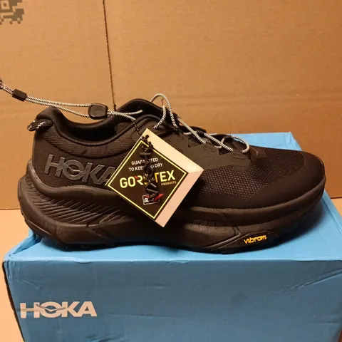 BOXED PAIR OF HOKA M TRANSPORT GTX TRAINERS IN BLACK - UK 8.5