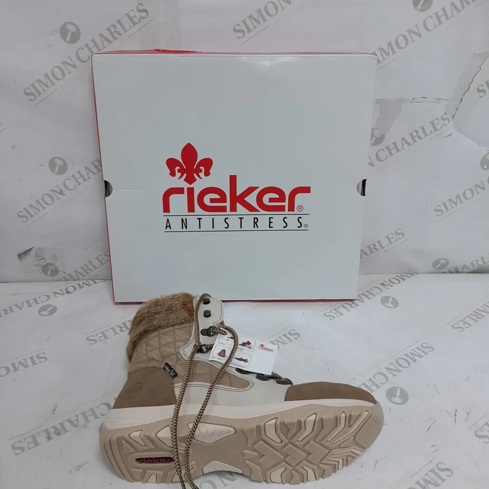 BOXED PAIR OF RIEKER CREAM WINTER FUR HIKE BOOTS IN SIZE 6