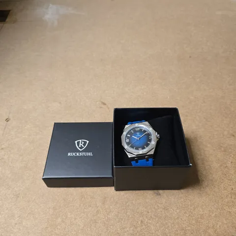 RUCKSTUHL WRISTWATCH WITH TWO TONE DIAL AND BLUE SILICONE STRAP – BOXED