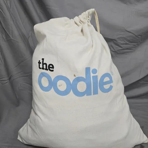 THE OODIE HOODIE BLANKET IN WHITE DRAWSTRING BAG WITH INSIDE OUT ANXIETY WEIGHTED BLANKET 