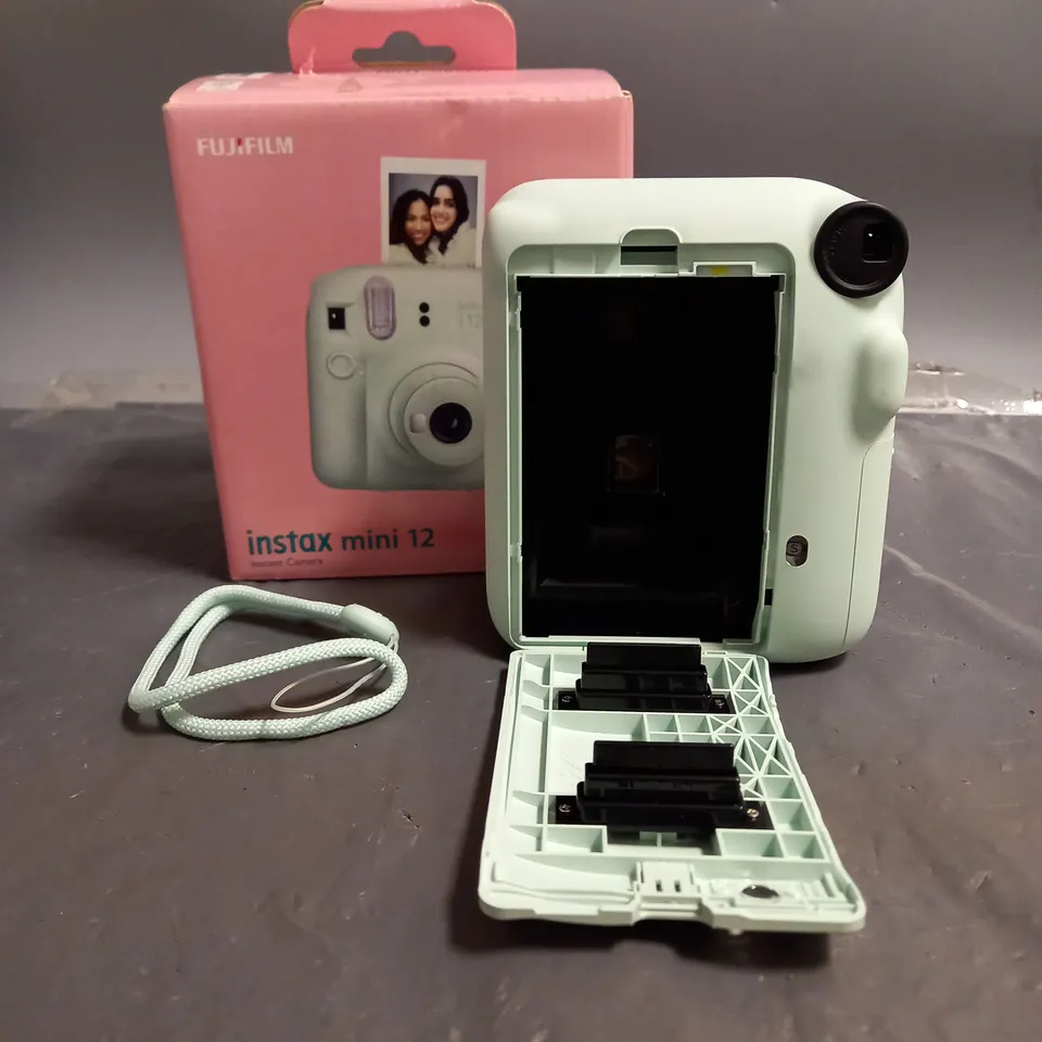 BOXED FUJIFILM INSTAX MINI 12 CAMERA IN MINT GREEN