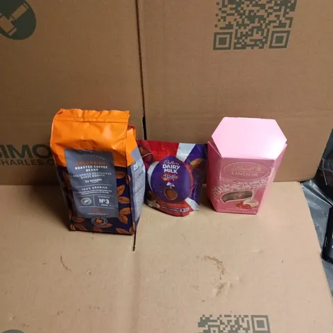 APPROXIMATELY 12 ASSORTED FOOD AND DRINKS ITEMS TO INCLUDE - COLUMBIAN ROASTED COFFED BEANS BY AMAZON, DAIRY MILK DAIM BAR MINI EGGS, LINDOR STRAWBERRIES & CREAM ETC 