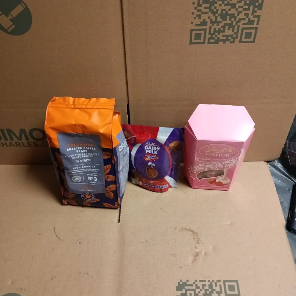 APPROXIMATELY 12 ASSORTED FOOD AND DRINKS ITEMS TO INCLUDE - COLUMBIAN ROASTED COFFED BEANS BY AMAZON, DAIRY MILK DAIM BAR MINI EGGS, LINDOR STRAWBERRIES & CREAM ETC 