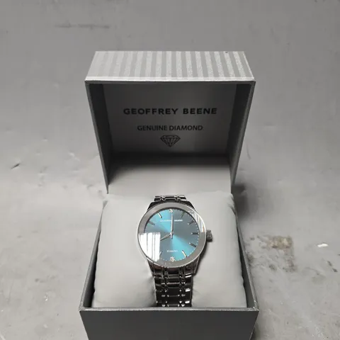 BOXED GEOFFERY BEENE TEAL DIAL CLASSIC WATCH 