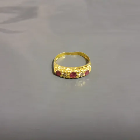 GOLD RING WITH 5 SET STONES 