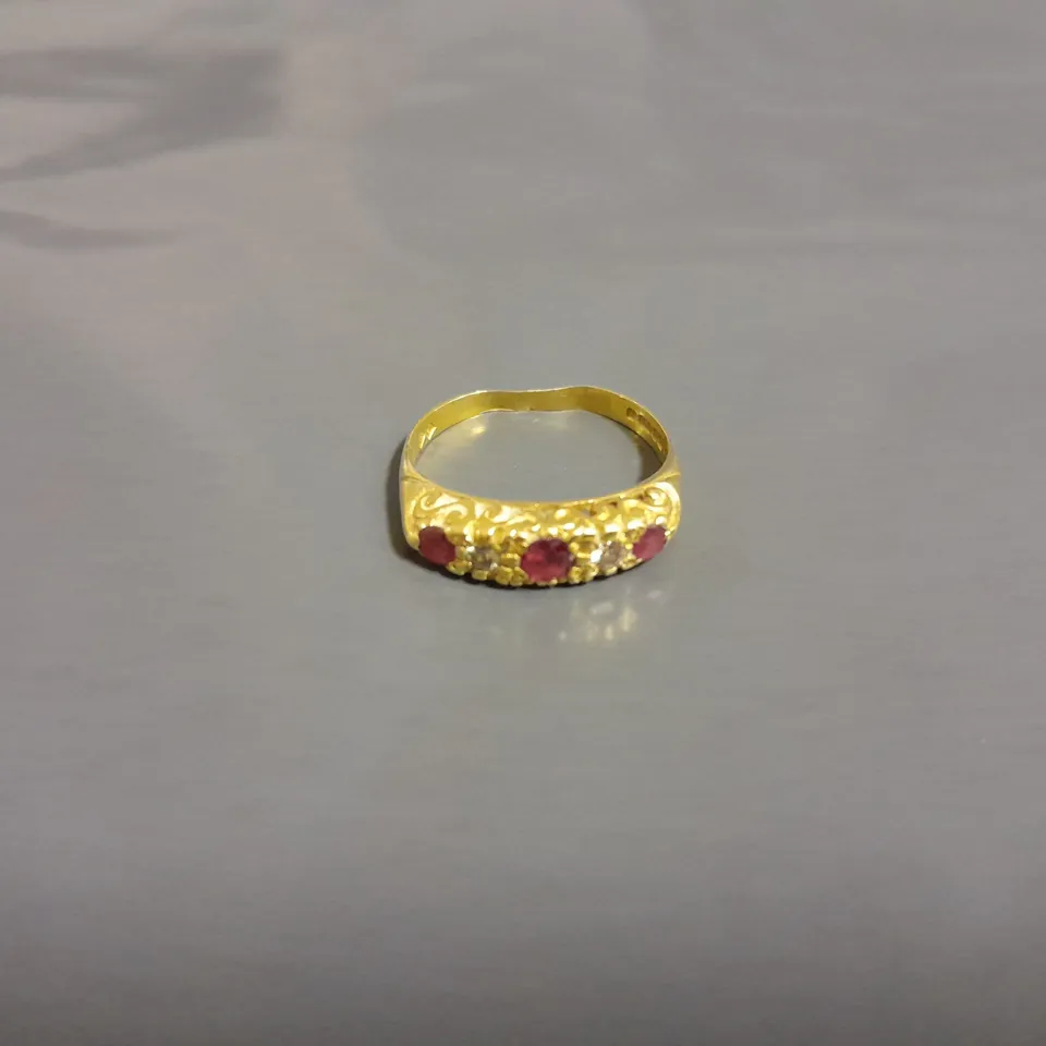 GOLD RING WITH 5 SET STONES 