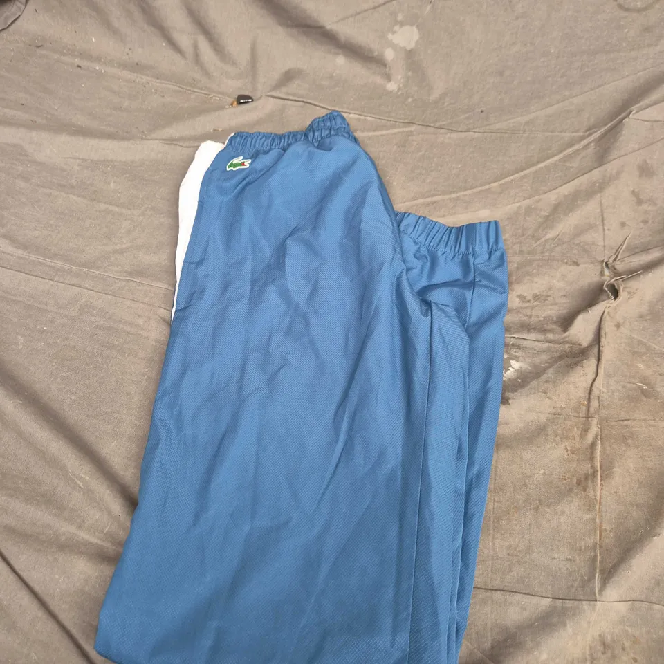 LACOSTE BLUE TRACK PANTS WITH WHITE SIDE STRIPE - SIZE XS