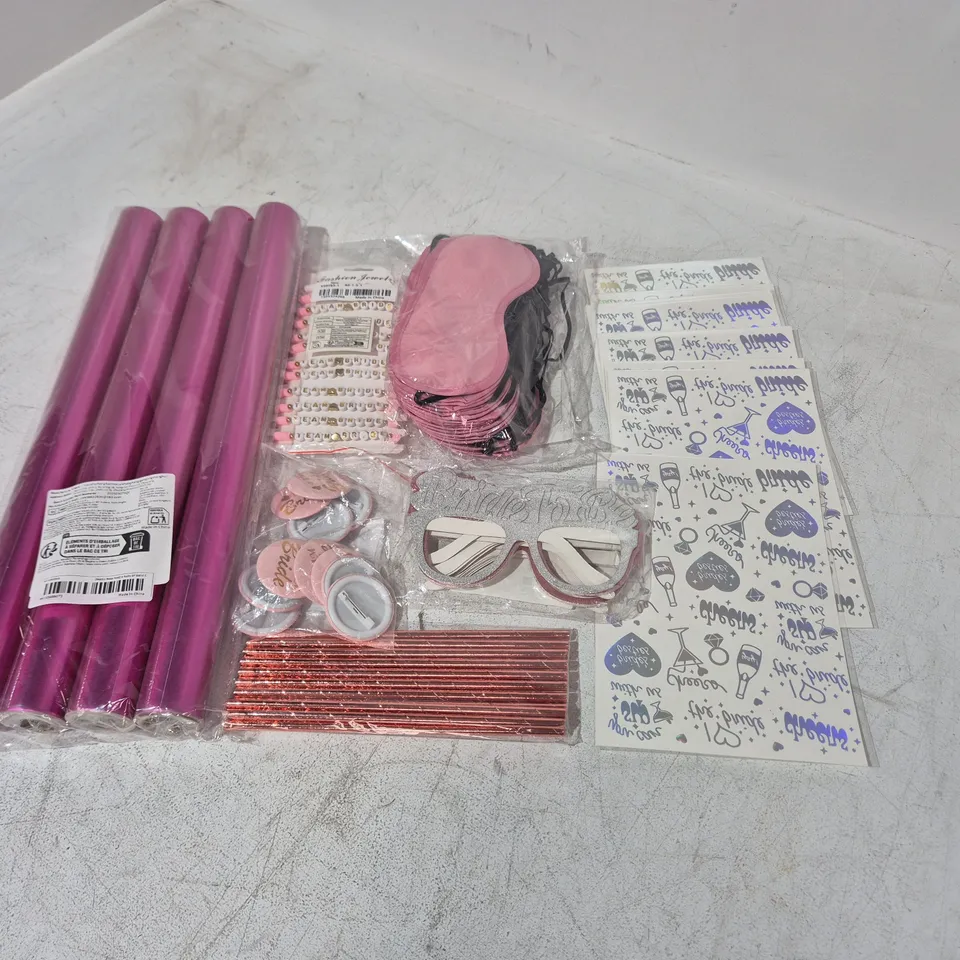 LOT OF ASSORTED BRIDESMAID THEMED PARTY ITEMS IN PINK TO INCLUDE GIFT WRAP. GLASSES, BADGES AND BRACELETS