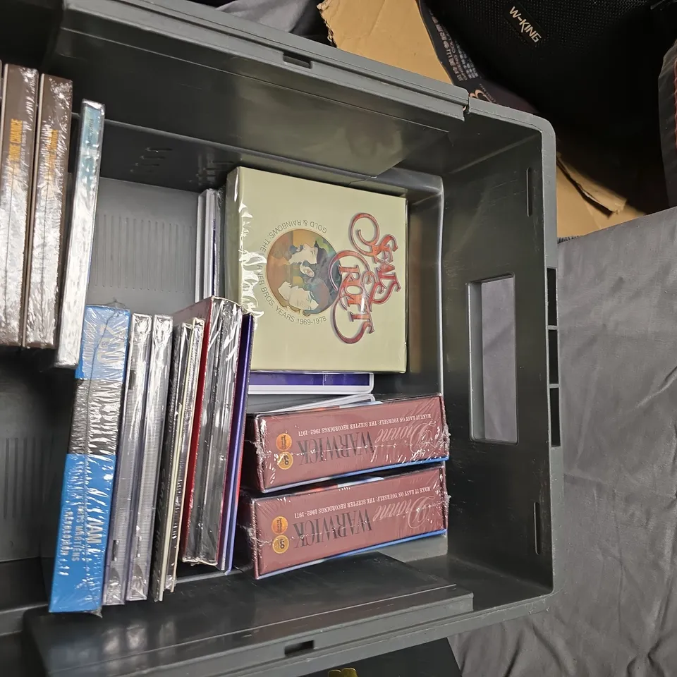 BOX OF ASSORTED DVDS AND CDS IN STORAGE BOX