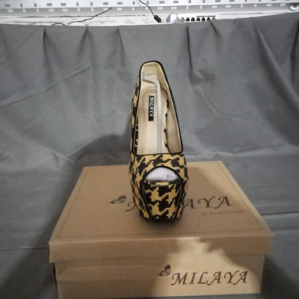 APPROXIMATELY 12 BOXED PAIR OF PLATFORM HEEL SHOES IN VARIOUS SIZES TO INCLUDE SIZE 36 