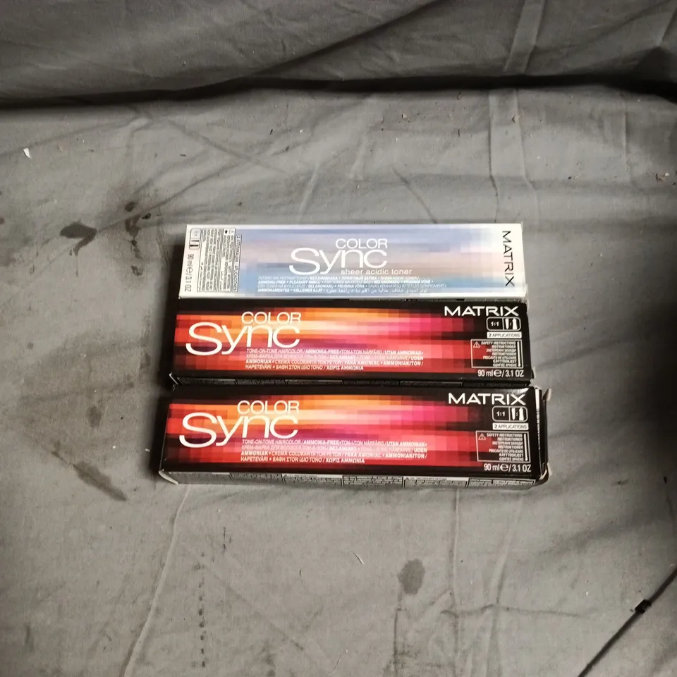 BOX OF APPROXIMATELY 65 HAIR CARE PRODUCTS INCLUDING MATRIX COLOR SYNC MAGENTA/VIOLET/BRUNETTE