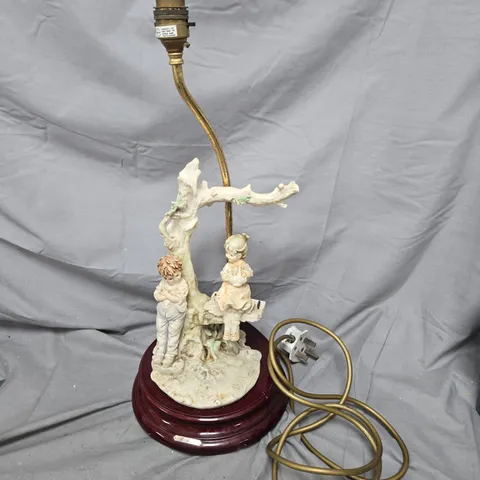 VINTAGE PORCELAIN FIGURAL LAMP WITH TWO CHILDREN UNDER TREE ON WOODEN BASE BY B MERLI